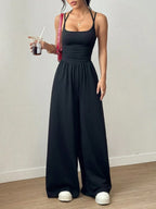 Dames Casual Effen Kleur Plooien Losse Rechte Jumpsuit A-lijn Backless Halter Hals Slanke Cami Jumpsuit Streetwear 2025