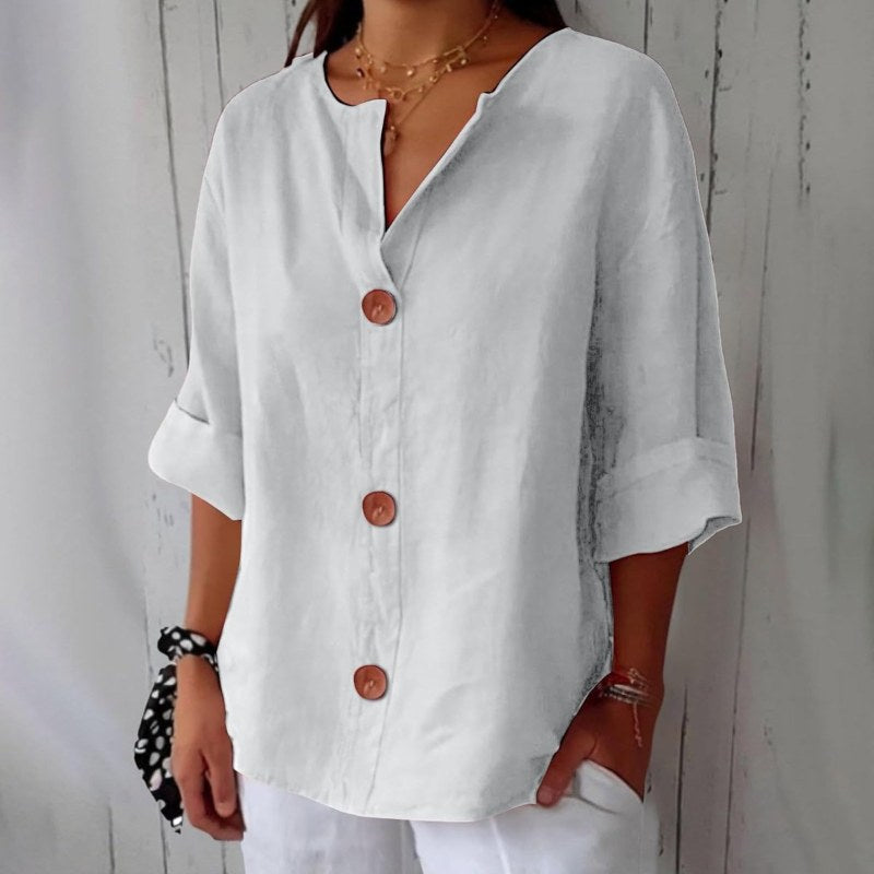 Elegant blus med v-ringning och knappstängning - White