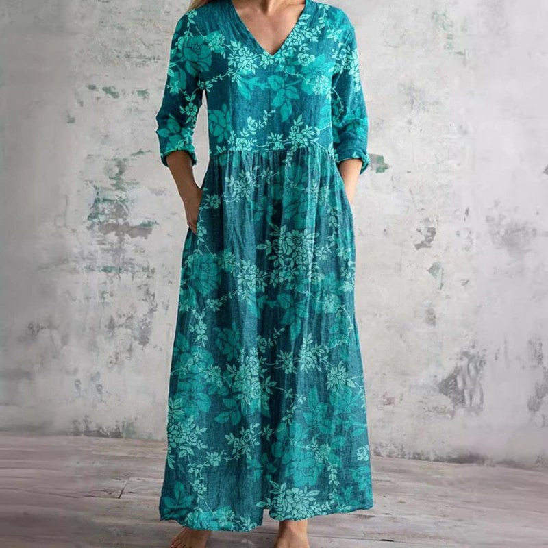 Elegant v-ringad maxiklänning med blommönster och långa ärmar - Blue